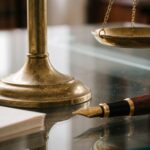 Scale_of_justice_on_desk_202608202142